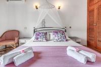 Postel nebo postele na pokoji v ubytování Eros Beach Hotel