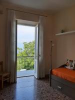 A bed or beds in a room at APPARTAMENTO CASA MARCO