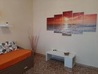 A seating area at APPARTAMENTO CASA MARCO