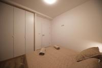 Postel nebo postele na pokoji v ubytování Apartmani Kiara