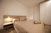 Postel nebo postele na pokoji v ubytování Apartmani Kiara