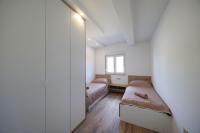 Postel nebo postele na pokoji v ubytování Apartmani Kiara