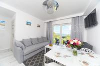 Telewizja i/lub zestaw kina domowego w obiekcie Porta Mare Apartments LuxView III