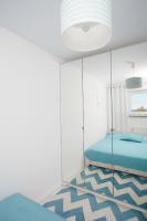 Łóżko lub łóżka w pokoju w obiekcie Porta Mare Apartments LuxView III
