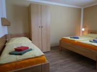 Postel nebo postele na pokoji v ubytování Pension Aspen Harrachov
