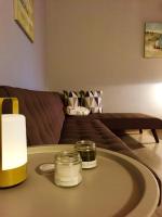 a living room with a table with candles on it at Genari Beach Apartments in Levendokhórion