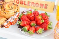 a plate of strawberries on a table with a plate of food at DÉPLACEMENT PRO &amp; TOURISME - NETFLIX - WIFI - Easy CHECK-IN in Bourg-la-Reine