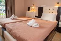 Posteľ alebo postele v izbe v ubytovaní Tereza's Sunset Hotel