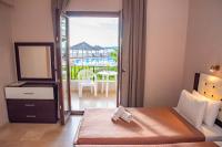 Posteľ alebo postele v izbe v ubytovaní Tereza's Sunset Hotel