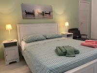 A bed or beds in a room at Librari - Quality confort