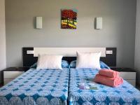A bed or beds in a room at Dukes Habitaciones