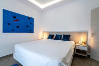 Posteľ alebo postele v izbe v ubytovaní M Mansion