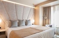 A bed or beds in a room at Nivia Born Boutique Hotel