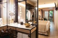 A bed or beds in a room at Nivia Born Boutique Hotel