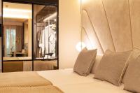 A bed or beds in a room at Nivia Born Boutique Hotel