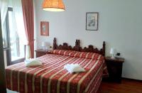 Łóżko lub łóżka w pokoju w obiekcie HG Hotel Italia