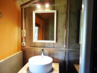 a bathroom with a sink and a mirror at Rives Nature in La Gacilly