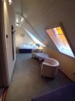 Łóżko lub łóżka w pokoju w obiekcie EMMA Apartman Harkány