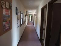 a hallway with a long hallway with a long hallwayngthngthngthngthngthngth at Guesthouse Sakuya in Fujikawaguchiko