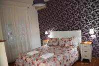 Posteľ alebo postele v izbe v ubytovaní Hostal El Puerto Boutique