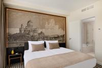 Posteľ alebo postele v izbe v ubytovaní Grand Hotel Esztergom