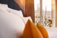 a hotel room with a view of the city at BEYOND by Geisel - Adults only in Munich