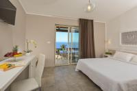 A bed or beds in a room at Castelsardo Resort Village
