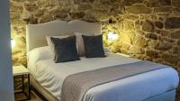 Łóżko lub łóżka w pokoju w obiekcie Hotel La Rectoral