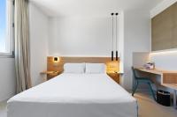 Posteľ alebo postele v izbe v ubytovaní Hotel Areca