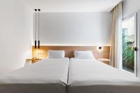 Posteľ alebo postele v izbe v ubytovaní Hotel Areca