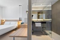 Posteľ alebo postele v izbe v ubytovaní Hotel Areca