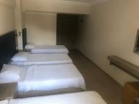A bed or beds in a room at Hamle Hotel