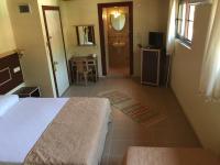 A bed or beds in a room at Hamle Hotel