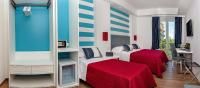 A bed or beds in a room at Hotel Angelina