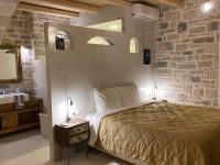 Posteľ alebo postele v izbe v ubytovaní VILLA SELINI LUXURY APARTMENT