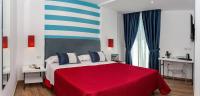 A bed or beds in a room at Hotel Angelina