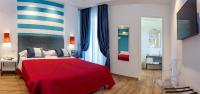 A bed or beds in a room at Hotel Angelina