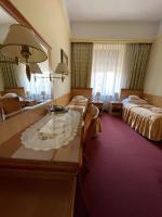 Łóżko lub łóżka w pokoju w obiekcie Hotel Europejski