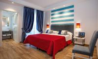 A bed or beds in a room at Hotel Angelina