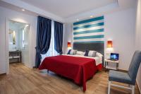 A bed or beds in a room at Hotel Angelina