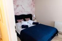 Posteľ alebo postele v izbe v ubytovaní Apartament Bella Rosa z podziemnym parkingiem