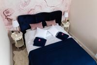 Posteľ alebo postele v izbe v ubytovaní Apartament Bella Rosa z podziemnym parkingiem