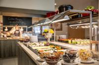 a buffet line with many different types of food at TUI BLUE Sylt in Rantum