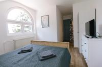 Televízia a/alebo spoločenská miestnosť v ubytovaní Alle Bed & Breakfast