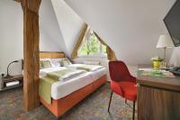 Postel nebo postele na pokoji v ubytování Maxmilian Lifestyle Resort