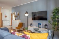 Televízia a/alebo spoločenská miestnosť v ubytovaní Ambria Apartments Platan Complex