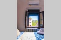 Posteľ alebo postele v izbe v ubytovaní Kala Nera seaside bnb