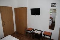 Televízia a/alebo spoločenská miestnosť v ubytovaní Obradović rooms & apartments