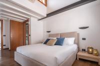 A bed or beds in a room at San Marco View Terrace Apartment R&R