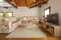 A television and/or entertainment centre at San Marco View Terrace Apartment R&R